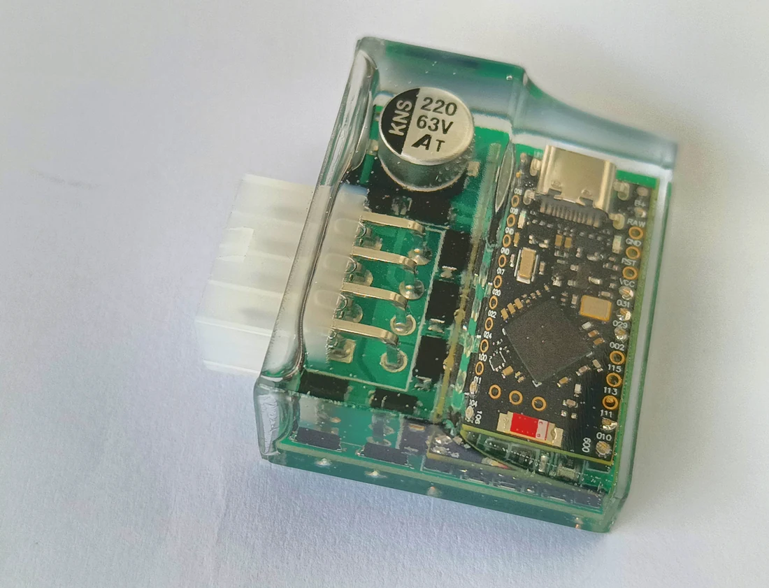 EasyRide circuit board with radio module and connector inside a transparent enclosure