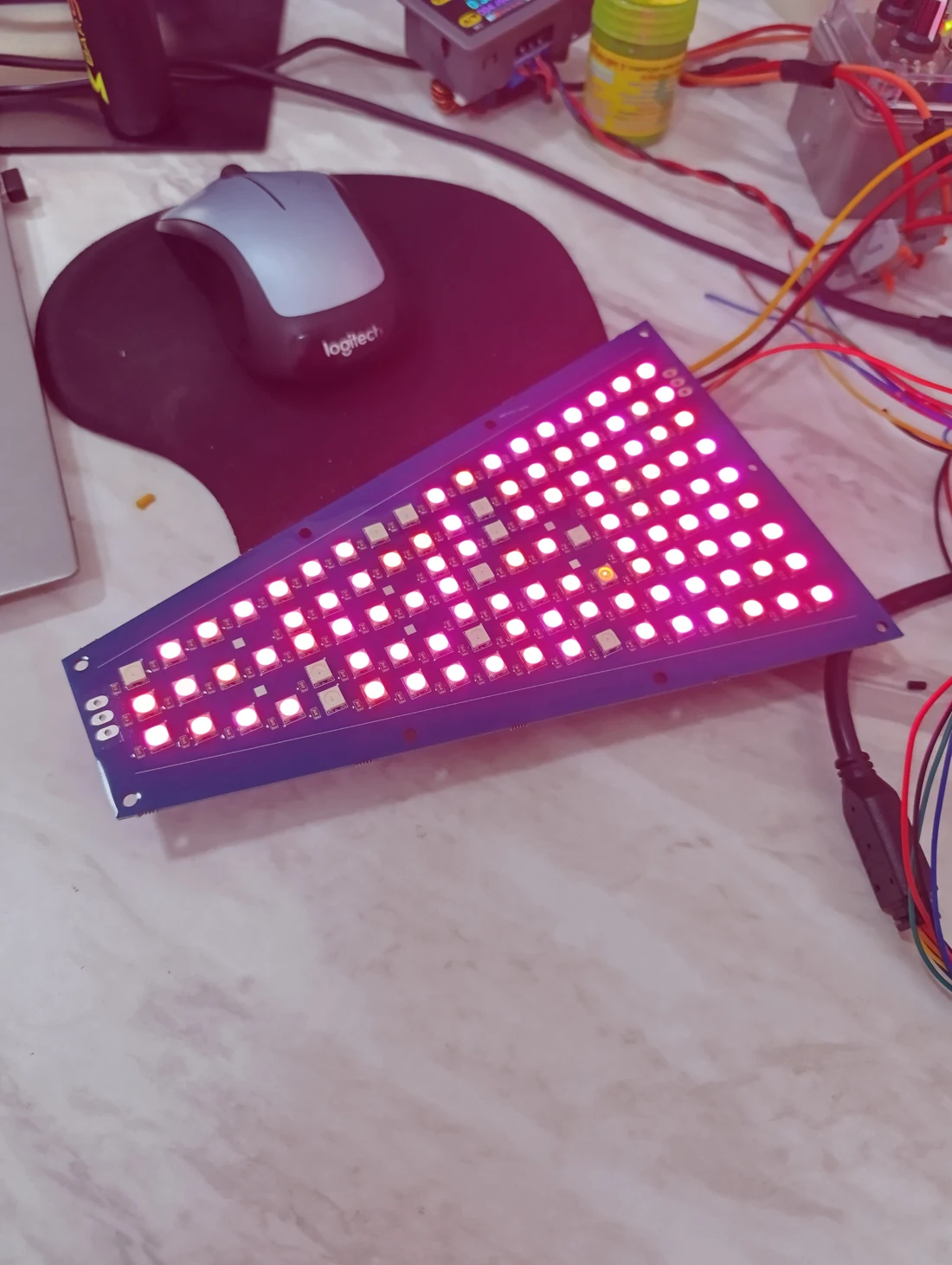 Tapered RGB LED display lit up during a workbench test
