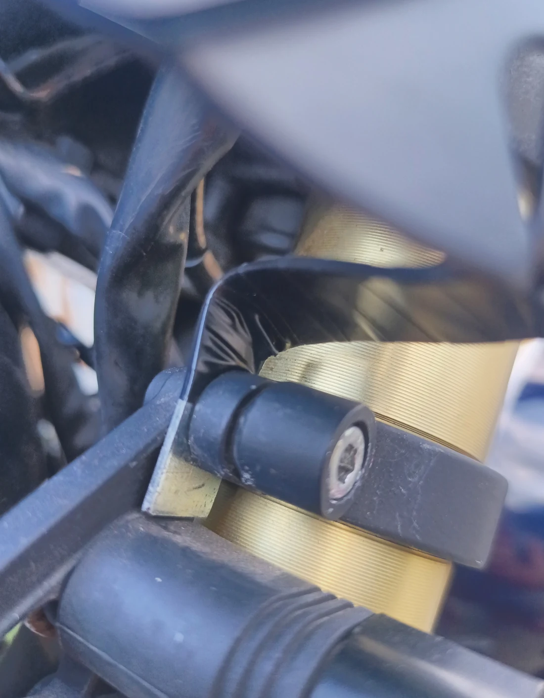 Close-up of the lower windscreen bracket at the existing headlight mounting point
